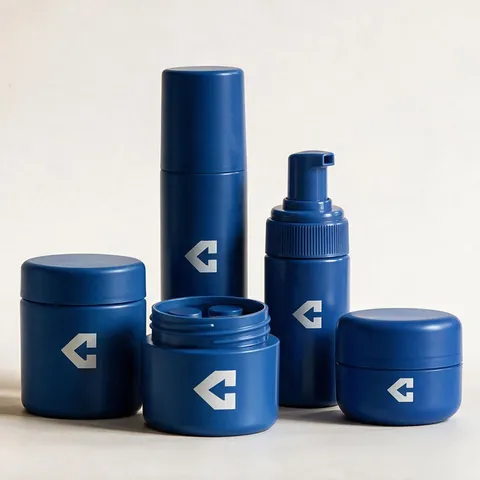 Five navy CentiPack containers grouped together — two screw-top jars, a tall dispenser, a pump bottle, and a wide jar standing open on its threaded neck.