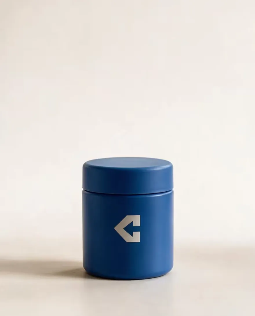 A closed navy pharmacy bottle.