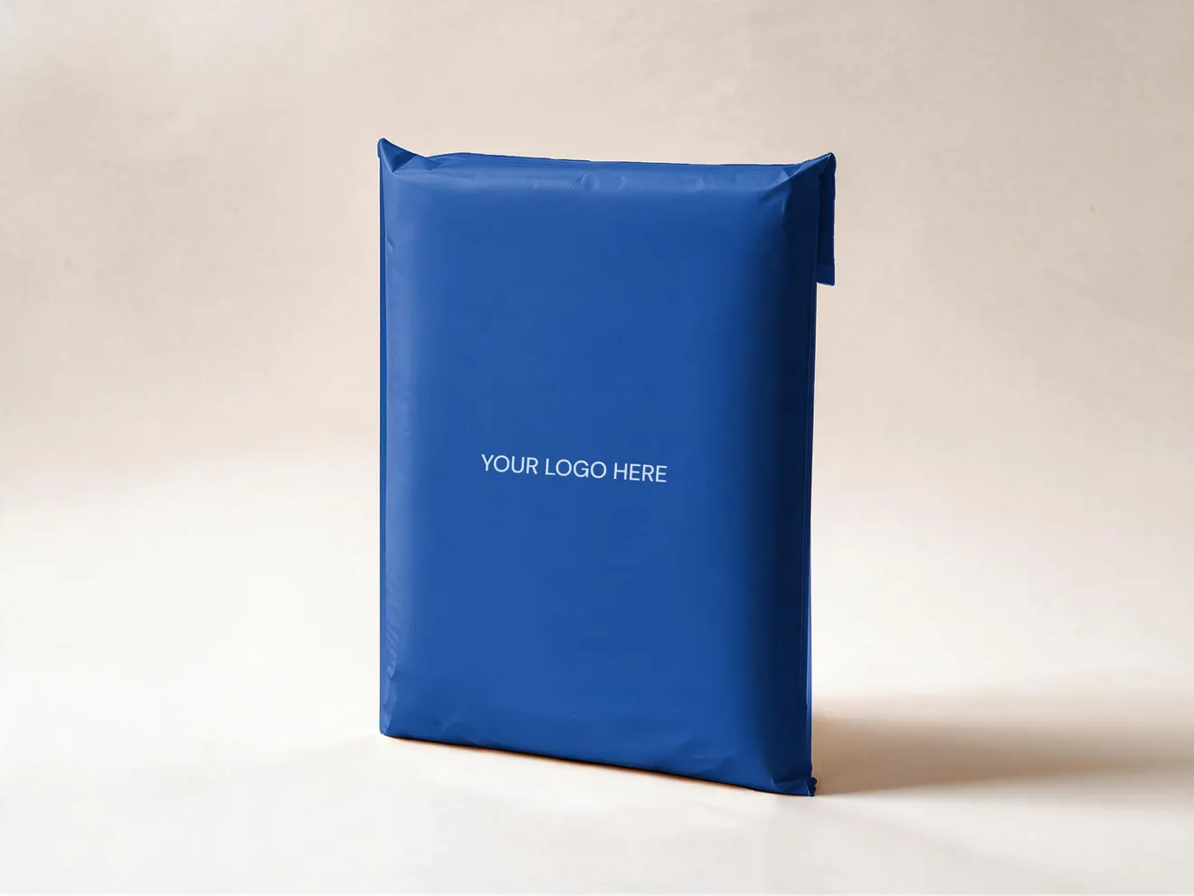 An expanded PuncturePack mailer standing on a cream ground, printed with a "Your logo here" placeholder.