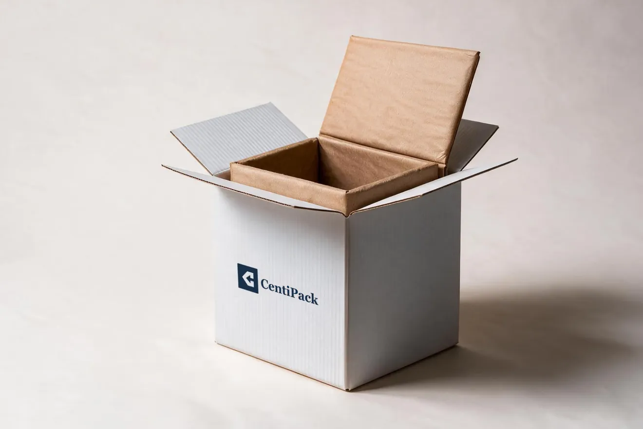 A kraft paper liner fitted inside an open white CentiPack carton, its top panel folded back.