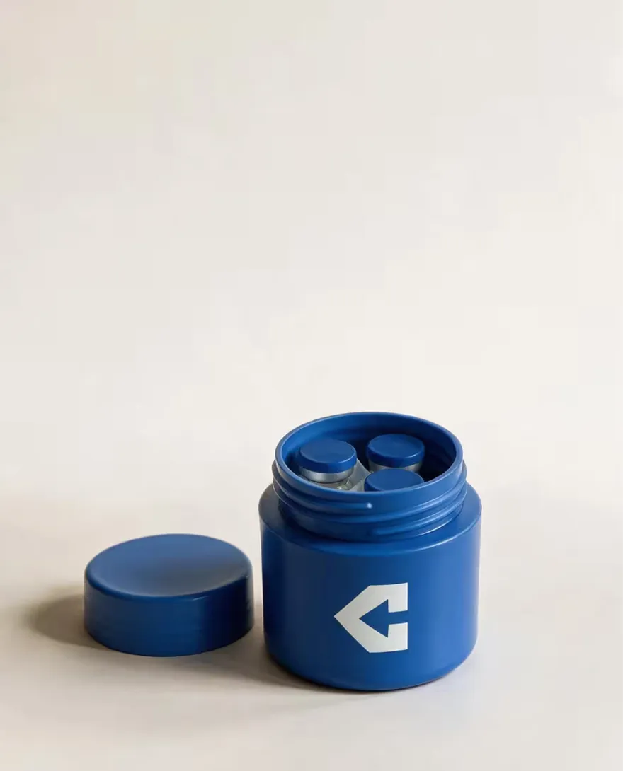 A branded jar opened to show vials inside.